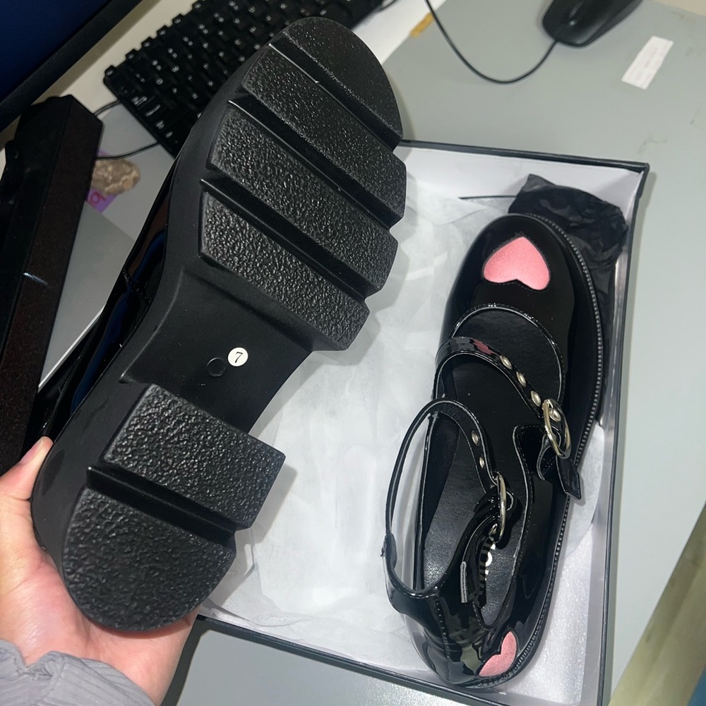 These are Platform Mary Jane shoes. They are brand new, black & Pink, size 9W.